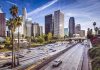 Downtown cityscape with skyscrapers and highway traffic