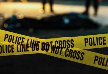 Police tape marking a crime scene at night