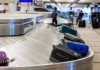 Luggage on airport baggage claim conveyor belt
