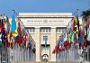 United Nations building with numerous national flags outside