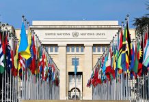 United Nations building with numerous national flags outside