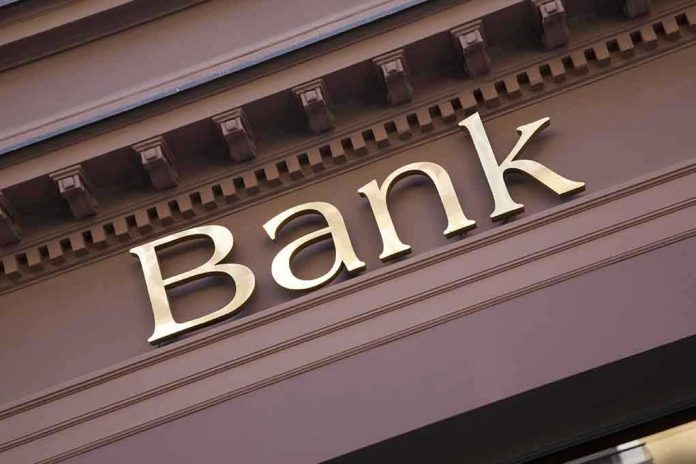 240120346 Gold bank sign on building facade