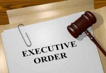A gavel resting on a document labeled EXECUTIVE ORDER