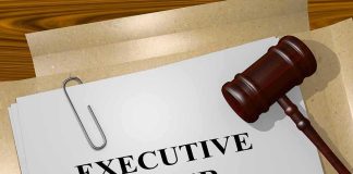 A gavel resting on a document labeled EXECUTIVE ORDER