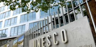 Exterior view of the UNESCO building with a prominent sign