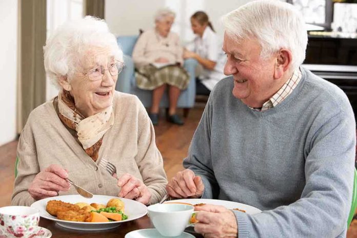 shutterstock_73623583.jpg Elderly couple enjoying a meal together in a dining room