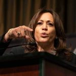 Person speaking passionately at a podium.