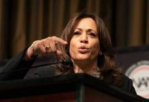 Person speaking passionately at a podium.