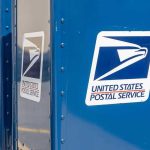 Blue USPS mail collection boxes in a row