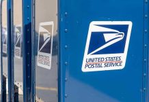 Blue USPS mail collection boxes in a row
