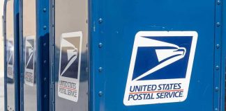 Blue USPS mail collection boxes in a row