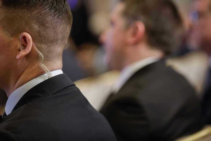 2260084817 Security personnel with earpiece in a suit.
