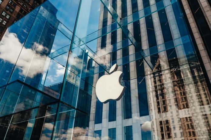2374133657 Apple store with glass facade and city reflections.