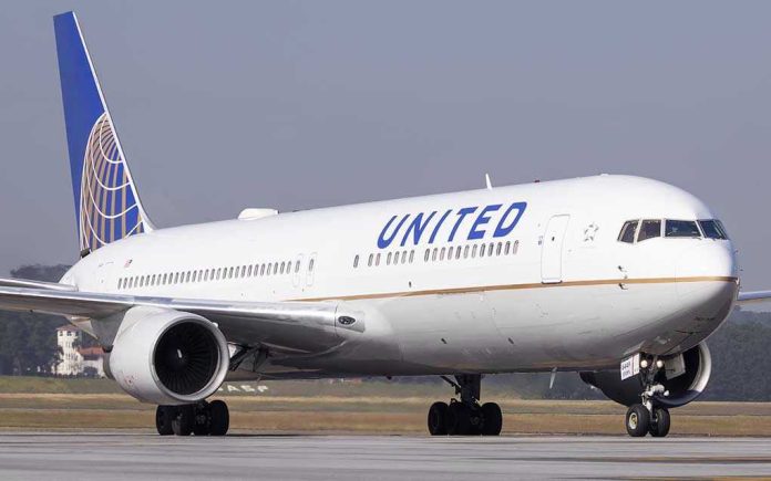 623296490 United Airlines plane on the runway.