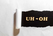 Torn paper revealing UH-OH text underneath.