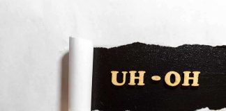 Torn paper revealing UH-OH text underneath.