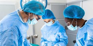 Surgeons performing an operation in a sterile environment.