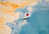 New Female Leader’s HAWKISH Stance Rattles Asia Map of Japan with flag pin placed nearby