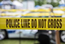 Chick-fil-A Horror: Unprovoked Attack Shocks Suburb Yellow police line tape with Do Not Cross.