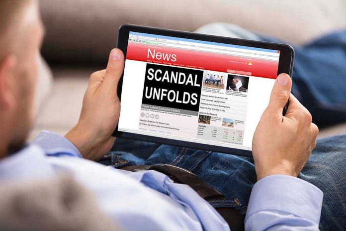 686343781 Person reading tablet with headline Scandal Unfolds.