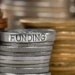 Billionaire’s RADICAL Move Destroys Charity Elites Stack of coins labeled funding with other coins stacks