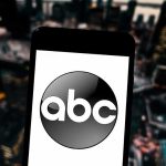 Vance DESTROYS ABC Anchor — Mic Cut! A smartphone displaying the ABC logo against an urban backdrop