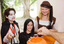 Halloween Candy Recall Sparks Panic Children in Halloween costumes collecting candy from a house