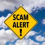 Fraud Shocker — Viral Assault Claim Was a Scam! Yellow warning sign displaying 'SCAM ALERT!' against a cloudy blue sky