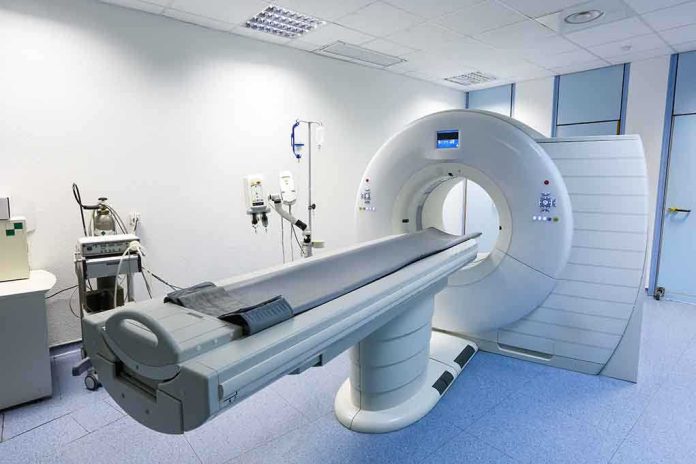 shutterstock_204885118.jpg A CT scanner in a hospital room with medical equipment nearby