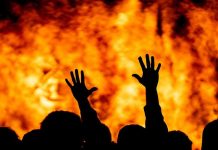 DEADLY Fire Kills 11 — Infrastructure COLLAPSES Silhouetted hands raised against a fiery background.
