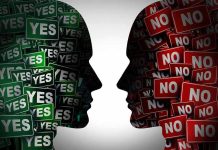 Silhouettes filled with YES and NO signs facing each other.