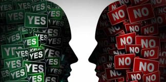 Silhouettes filled with YES and NO signs facing each other.