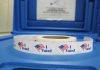 Election Tech Disaster—Wrong Winner Sworn In Roll of I Voted stickers on table.