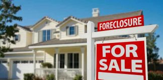 House for sale with foreclosure sign.