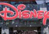 Bright red Disney logo displayed on a storefront window