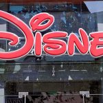 Bright red Disney logo displayed on a storefront window