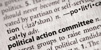 Close-up of a dictionary entry for political action committee