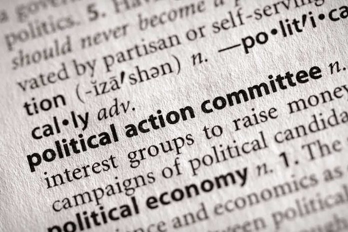 Close-up of a dictionary entry for political action committee