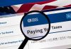 Indiana Taxpayers Bled Dry as Lawmakers Stall Magnifying glass over IRS website for paying taxes.