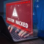94GB Breach: Hackers Threaten Adult Website Users Warning sign System Hacked on laptop screen.