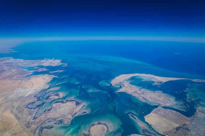2302575467 Aerial view of coastline and ocean.