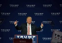 Man giving thumbs up at Trump Pence rally.