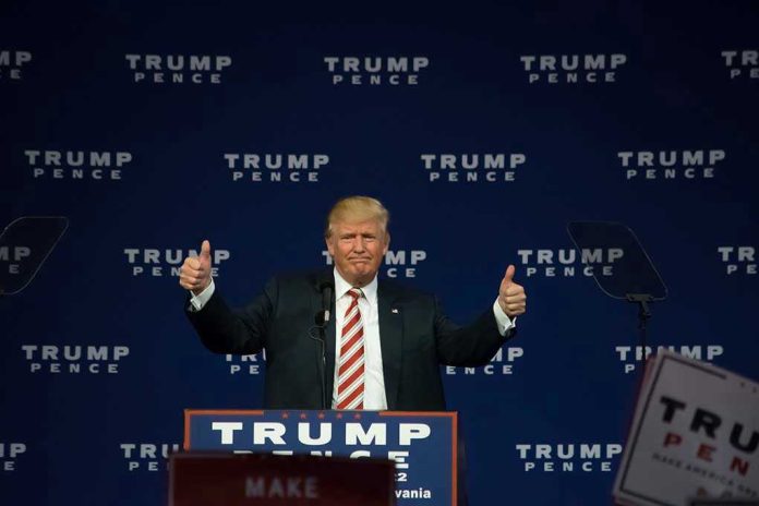 487546267 Man giving thumbs up at Trump Pence rally.
