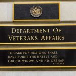 VA EXPOSED: Veterans Used As Drug Guinea Pigs Department of Veterans Affairs building sign with quote.