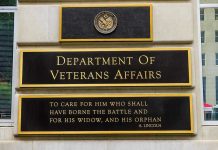 VA EXPOSED: Veterans Used As Drug Guinea Pigs Department of Veterans Affairs building sign with quote.