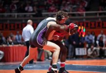 High School Hero’s DARK Secret Exposed Two wrestlers competing on a mat during a match