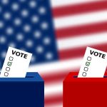 Ballots in boxes with American flag background.