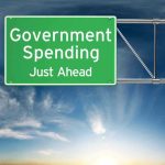 Green road sign: Government Spending Just Ahead.