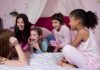 Gaming Consoles Got Pricier Group of children laughing and enjoying a sleepover in a cozy bedroom