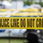 This Murder is on Biden Yellow police line tape with Do Not Cross.